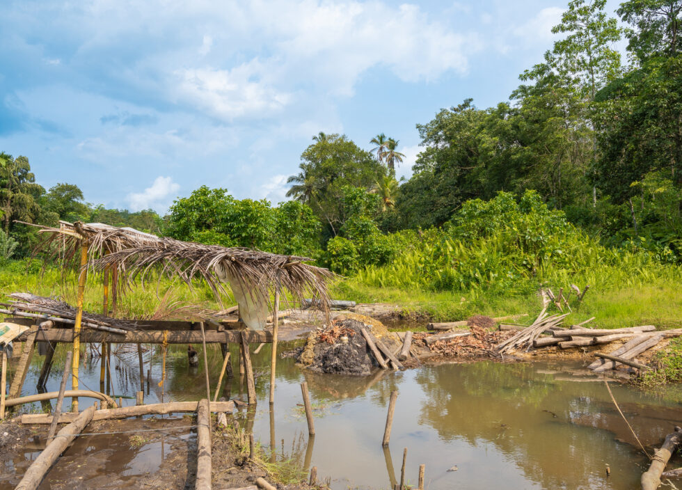 View of a mechanised mining site in Sri Lanka, featuring an open-water pit.